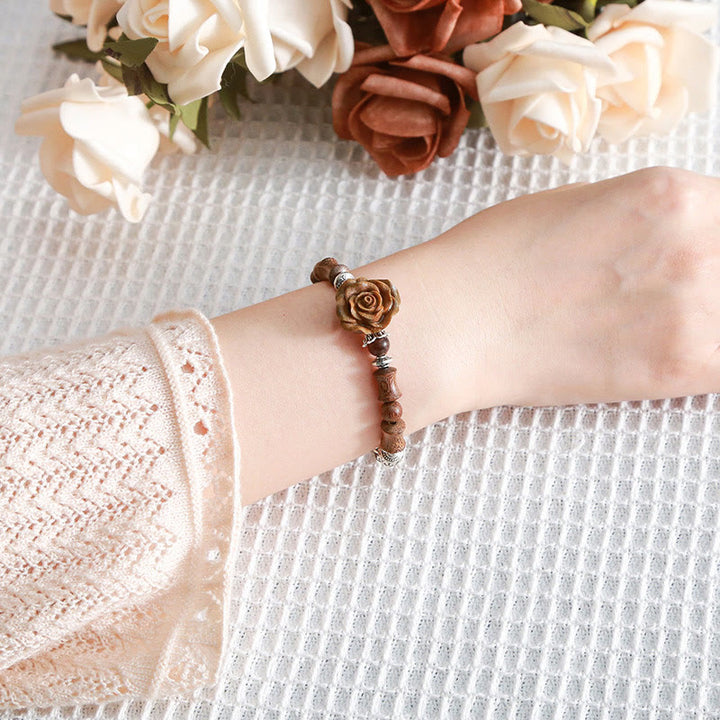 Pulsera curativa con diseño de camelias y Buddha Stones , madera de sándalo y bambú
