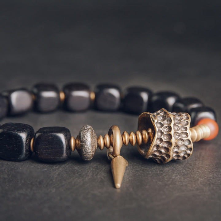 Pulsera de la paz con Buddha Stones, ébano, madera, cobre, latón y ágata roja