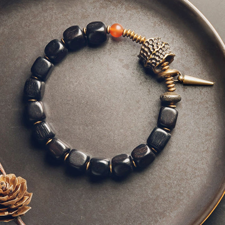 Pulsera de la paz con Buddha Stones, ébano, madera, cobre, latón y ágata roja