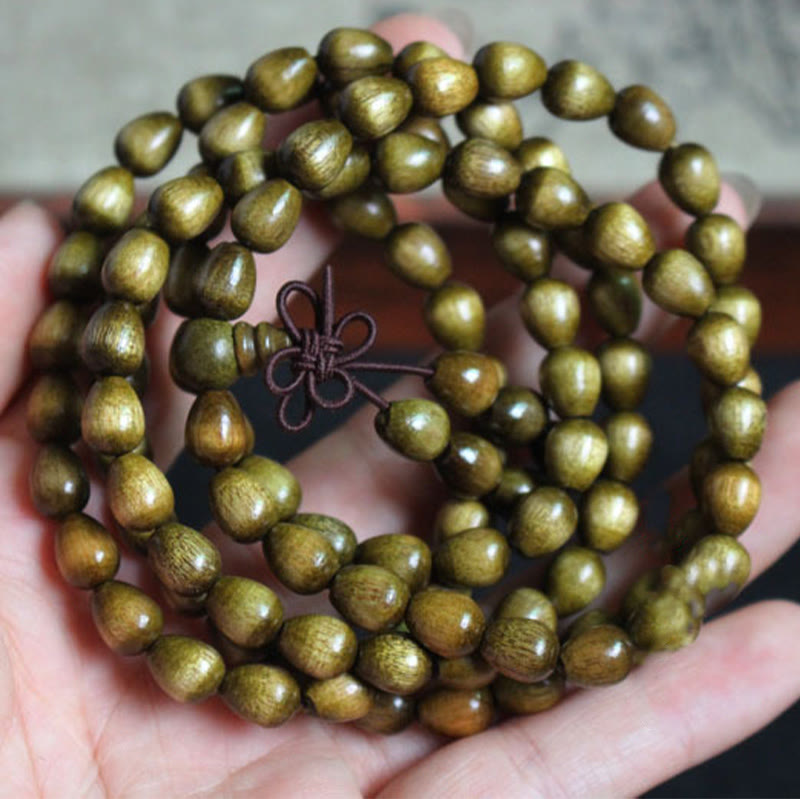 Pulsera de protección de madera natural Phoebe Zhennan con 108 cuentas en forma de lágrima y Buddha Stones