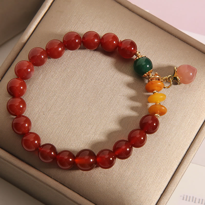 Pulsera de autoaceptación con dijes de melocotón, ámbar y ágata roja de Buddha Stones - image 3