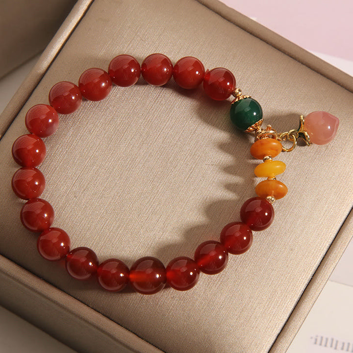 Pulsera de autoaceptación con dijes de melocotón, ámbar y ágata roja de Buddha Stones - image 3
