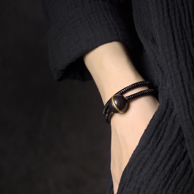 Pulsera de doble vuelta con forma de cubo y bola de equilibrio de latón, cobre y madera de ébano y Buddha Stones