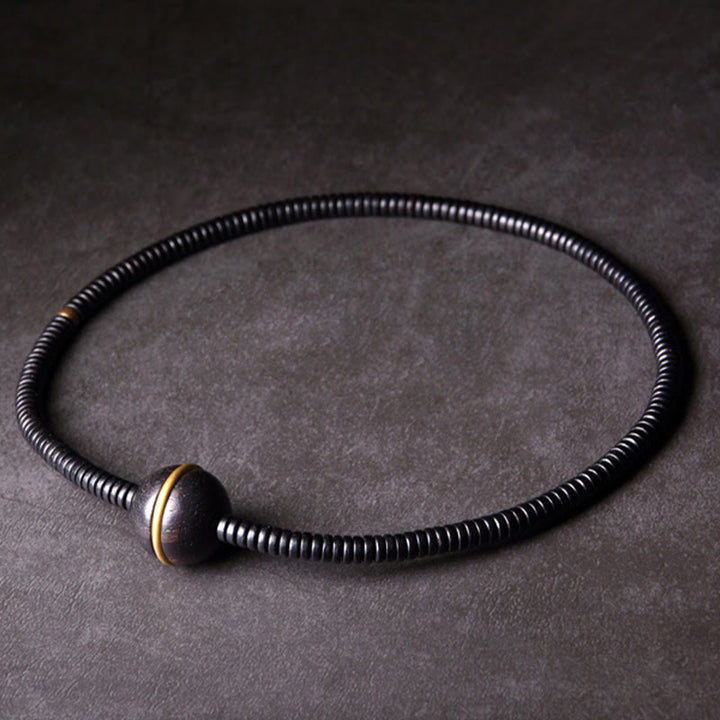 Pulsera de doble vuelta con forma de cubo y bola de equilibrio de latón, cobre y madera de ébano y Buddha Stones