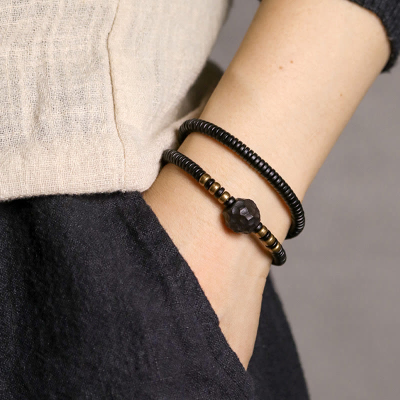 Pulsera de doble vuelta con Buddha Stones, madera de ébano, cobre y latón