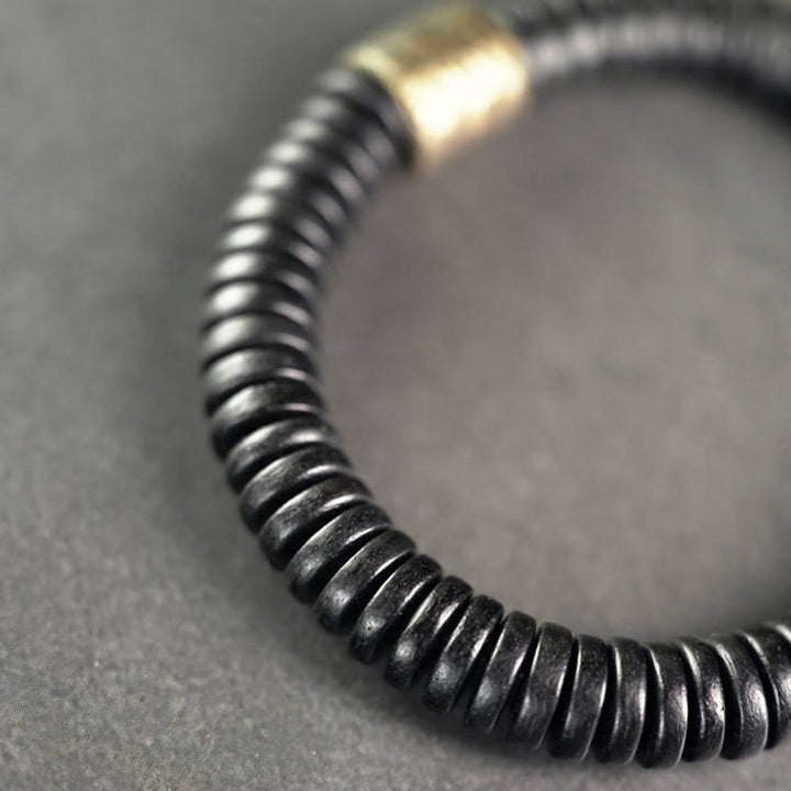 Pulsera de calma con Buddha Stones, madera de ébano, cobre y latón