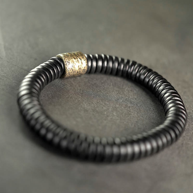 Pulsera de calma con Buddha Stones, madera de ébano, cobre y latón