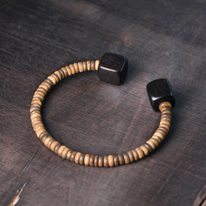 Pulsera de equilibrio con forma de cubo de sándalo verde y madera de ébano y Buddha Stones