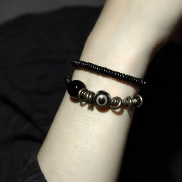 Pulsera de doble vuelta con cuentas Dzi de latón, cobre, sándalo verde, madera de ébano y Buddha Stones