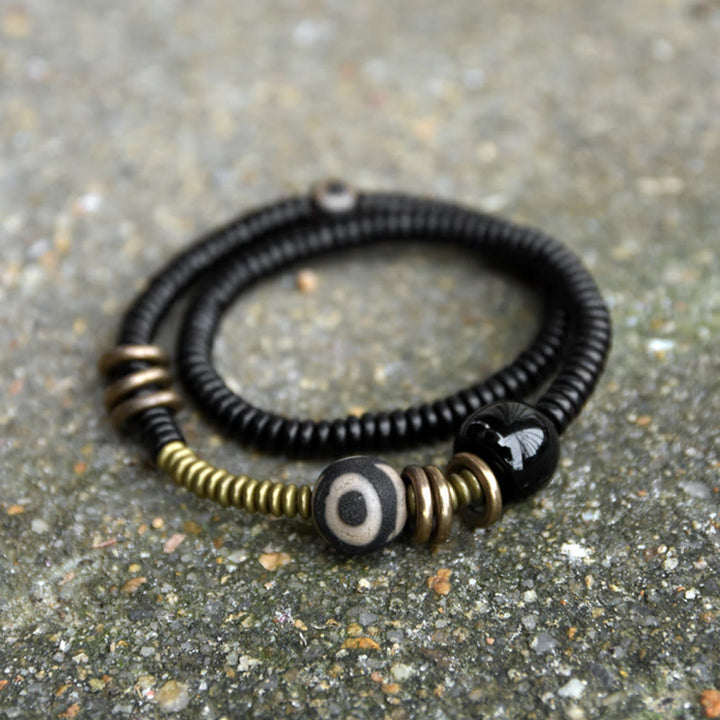 Pulsera de doble vuelta con cuentas Dzi de latón, cobre, sándalo verde, madera de ébano y Buddha Stones