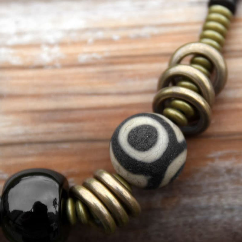 Pulsera de doble vuelta con cuentas Dzi de latón, cobre, sándalo verde, madera de ébano y Buddha Stones