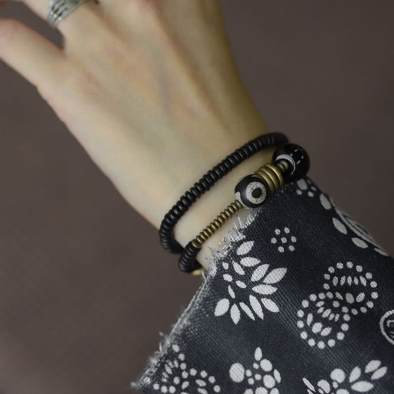 Pulsera de doble vuelta con cuentas Dzi de latón, cobre, sándalo verde, madera de ébano y Buddha Stones