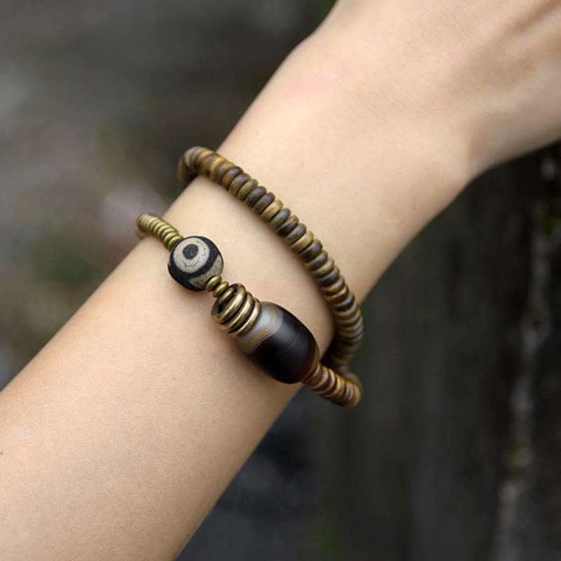 Pulsera de doble vuelta con cuentas Dzi de latón, cobre, sándalo verde, madera de ébano y Buddha Stones