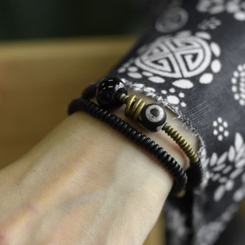Pulsera de doble vuelta con cuentas Dzi de latón, cobre, sándalo verde, madera de ébano y Buddha Stones