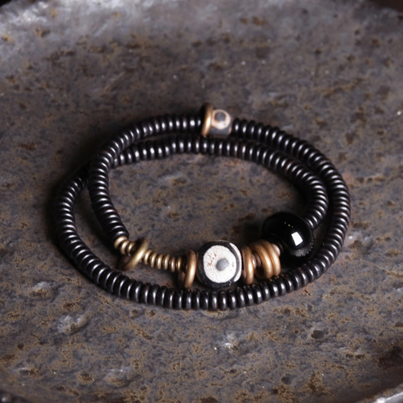 Pulsera de doble vuelta con cuentas Dzi de latón, cobre, sándalo verde, madera de ébano y Buddha Stones