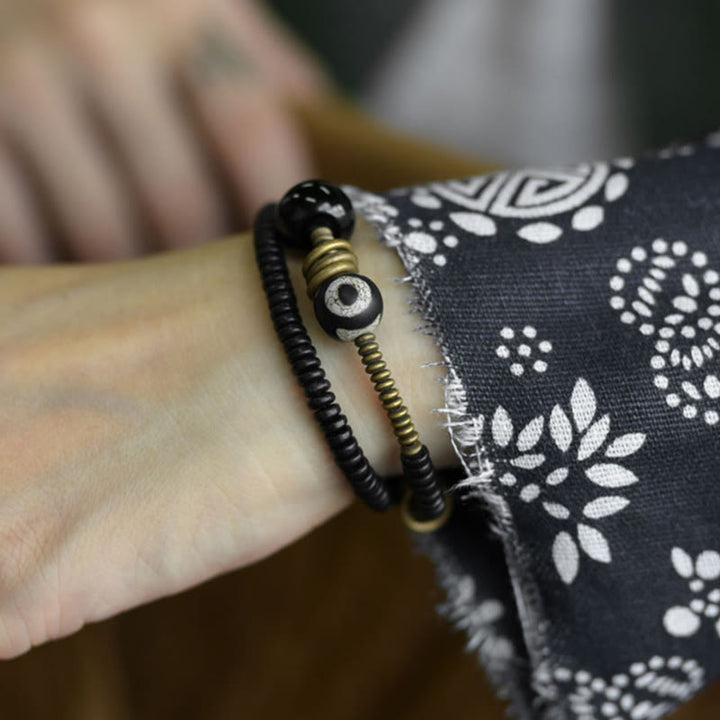 Pulsera de doble vuelta con cuentas Dzi de latón, cobre, sándalo verde, madera de ébano y Buddha Stones