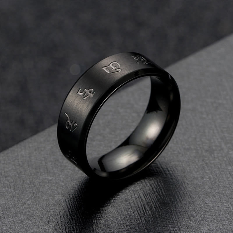 Anillo de equilibrio de acero y titanio con mantra Jambhala negro y Buddha Stones