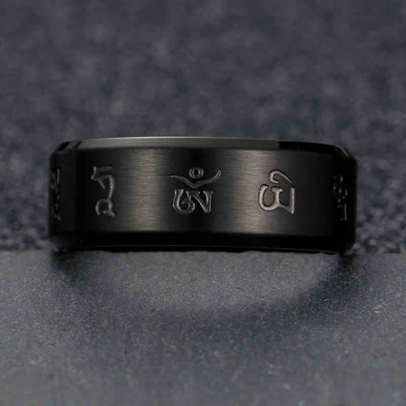 Anillo de equilibrio de acero y titanio con mantra Jambhala negro y Buddha Stones