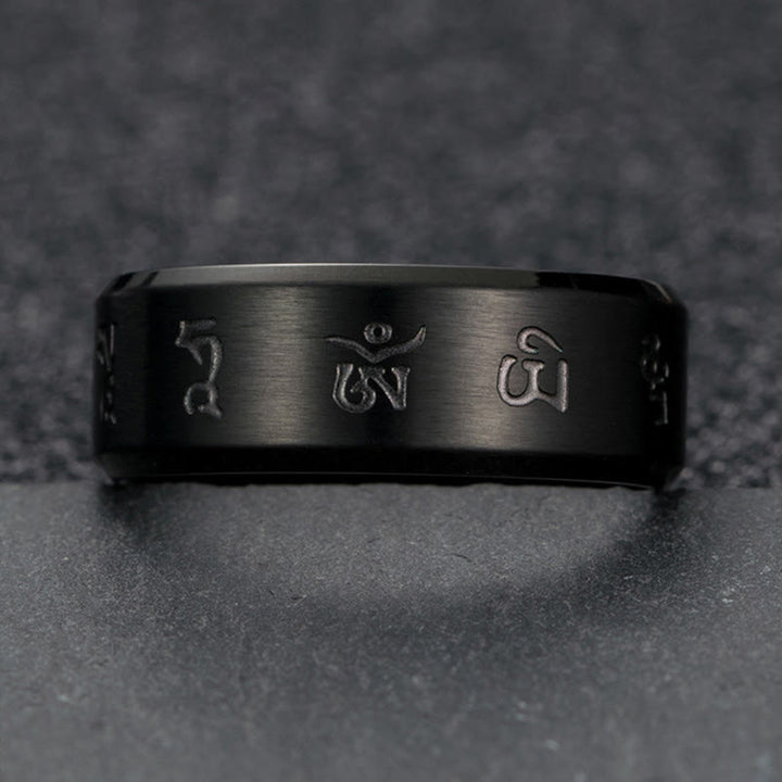 Anillo de equilibrio de acero y titanio con mantra Jambhala negro y Buddha Stones