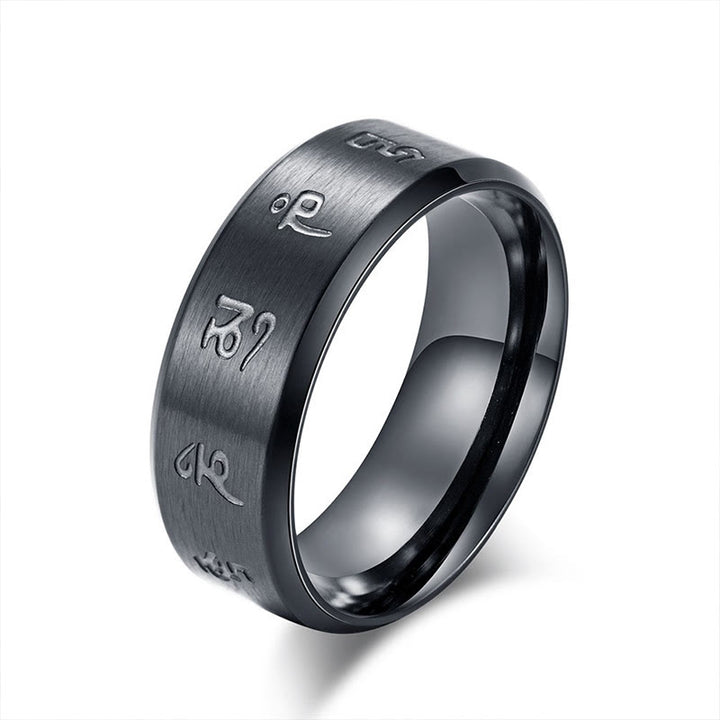 Anillo de equilibrio de acero y titanio con mantra Jambhala negro y Buddha Stones