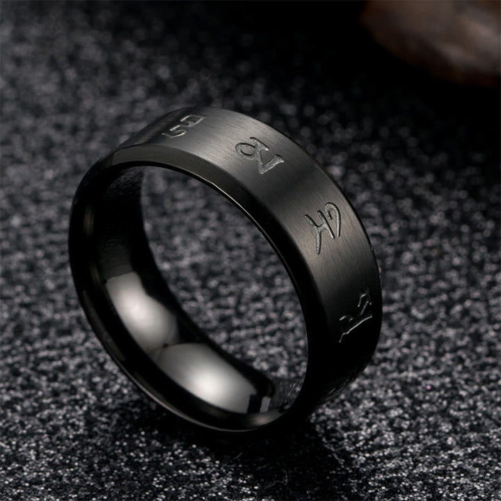 Anillo de equilibrio de acero y titanio con mantra Jambhala negro y Buddha Stones