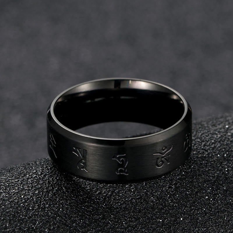Anillo de equilibrio de acero y titanio con mantra Jambhala negro y Buddha Stones