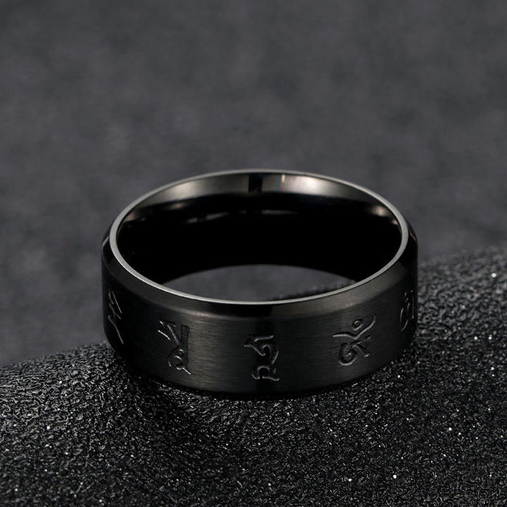 Anillo de equilibrio de acero y titanio con mantra Jambhala negro y Buddha Stones