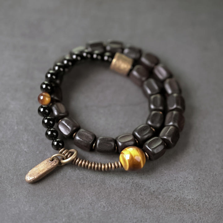 Pulsera de doble vuelta con Buddha Stones, madera de ébano, cobre, latón y ojo de tigre