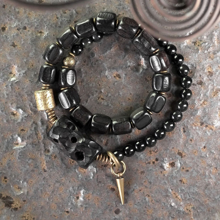 Pulsera de doble vuelta con Buddha Stones, madera de ébano, obsidiana negra, cobre y latón
