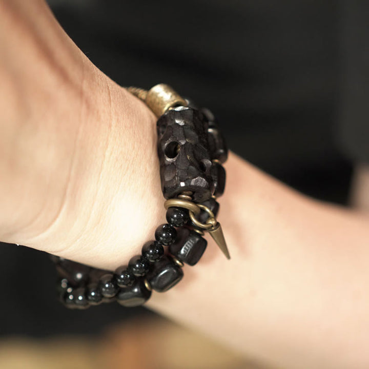 Pulsera de doble vuelta con Buddha Stones, madera de ébano, obsidiana negra, cobre y latón