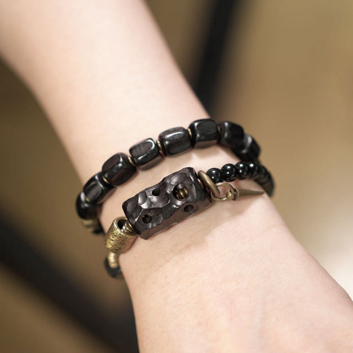 Pulsera de doble vuelta con Buddha Stones, madera de ébano, obsidiana negra, cobre y latón