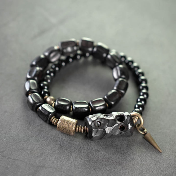 Pulsera de doble vuelta con Buddha Stones, madera de ébano, obsidiana negra, cobre y latón