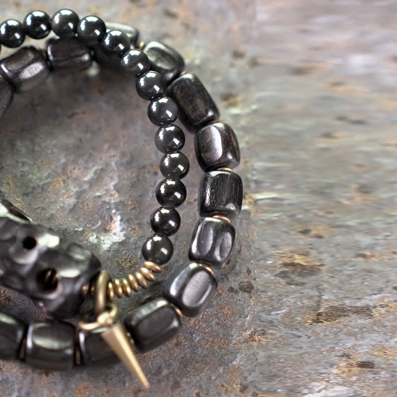 Pulsera de doble vuelta con Buddha Stones, madera de ébano, obsidiana negra, cobre y latón