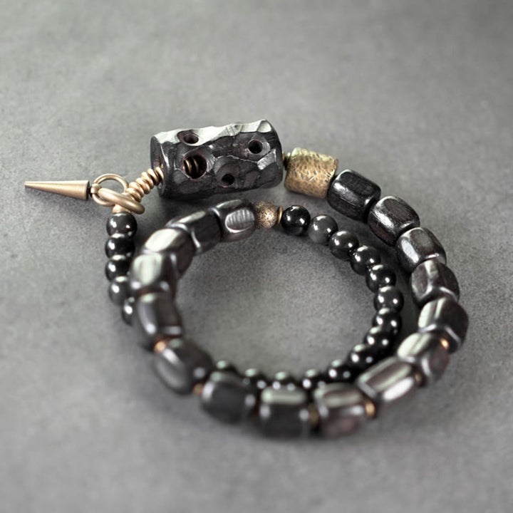 Pulsera de doble vuelta con Buddha Stones, madera de ébano, obsidiana negra, cobre y latón
