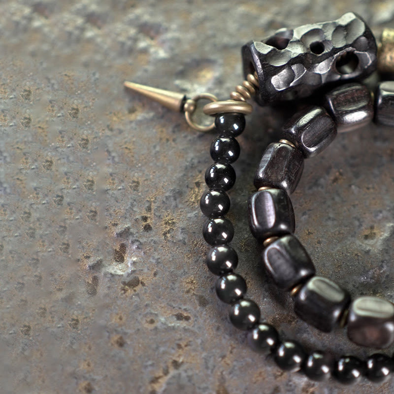 Pulsera de doble vuelta con Buddha Stones, madera de ébano, obsidiana negra, cobre y latón