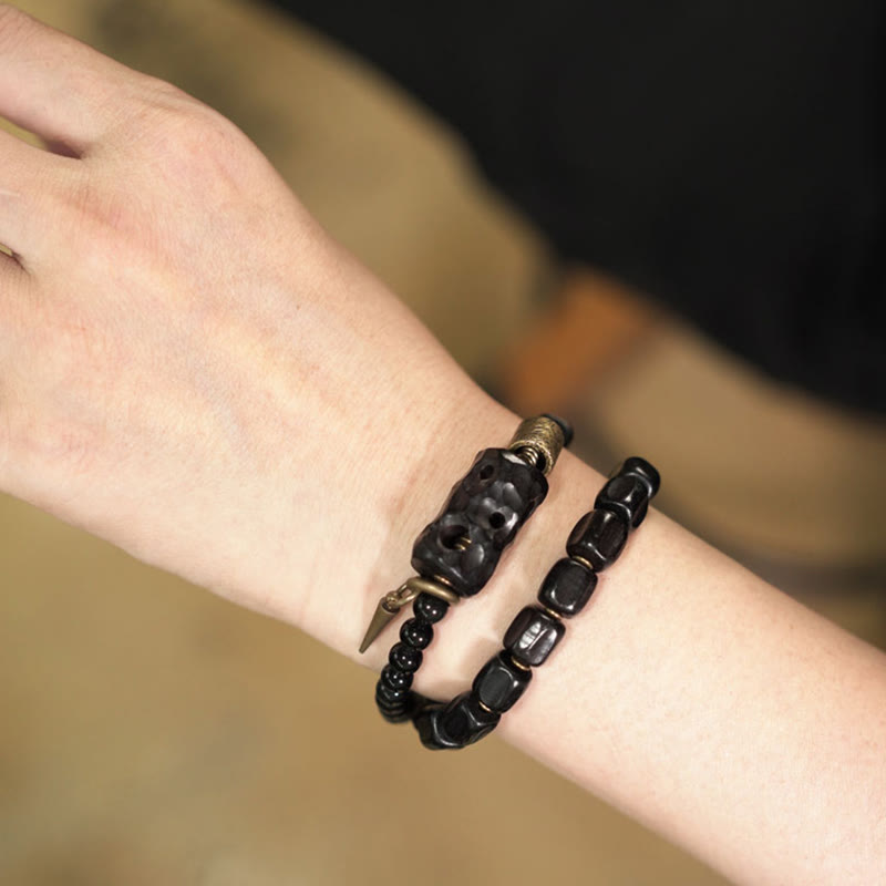 Pulsera de doble vuelta con Buddha Stones, madera de ébano, obsidiana negra, cobre y latón