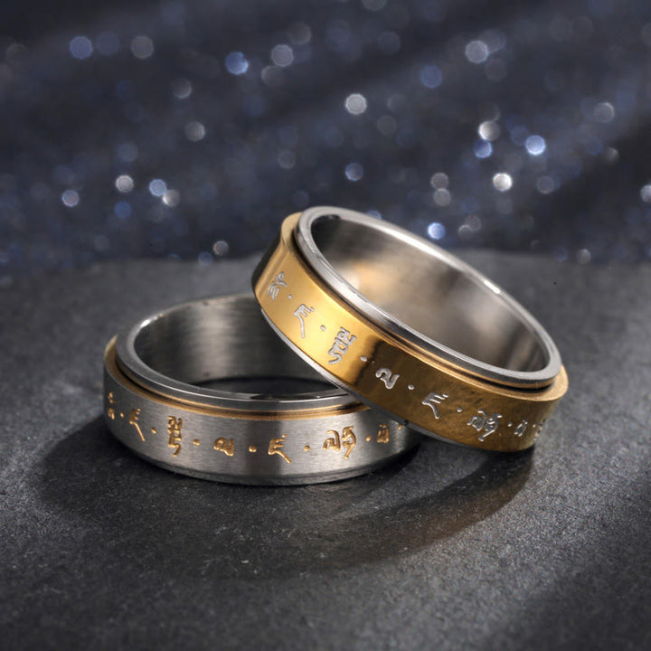Anillo giratorio de equilibrio de acero y titanio con mantra tibetano y Buddha Stones