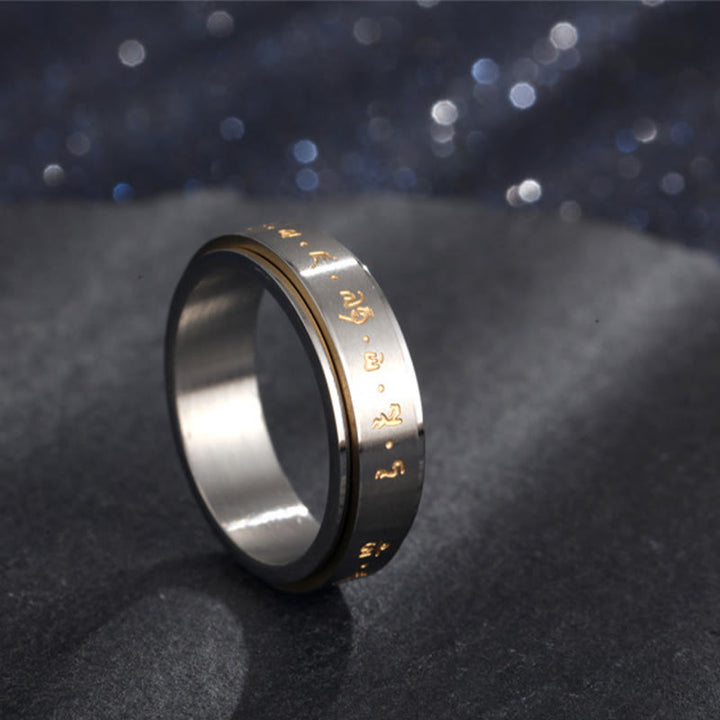 Anillo giratorio de equilibrio de acero y titanio con mantra tibetano y Buddha Stones