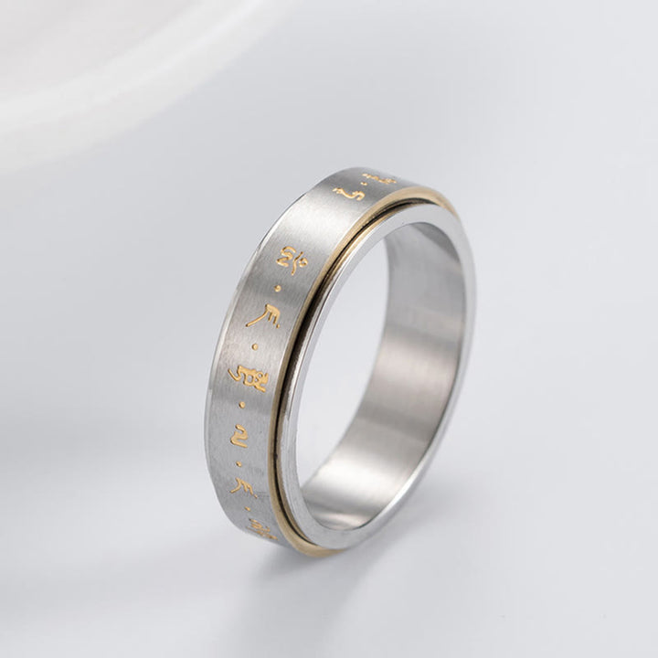 Anillo giratorio de equilibrio de acero y titanio con mantra tibetano y Buddha Stones
