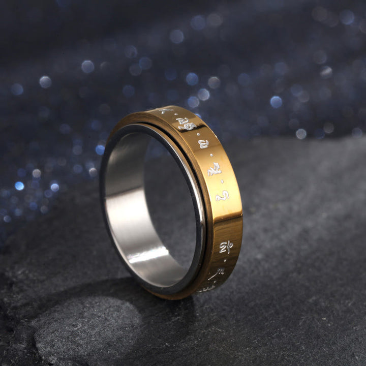 Anillo giratorio de equilibrio de acero y titanio con mantra tibetano y Buddha Stones