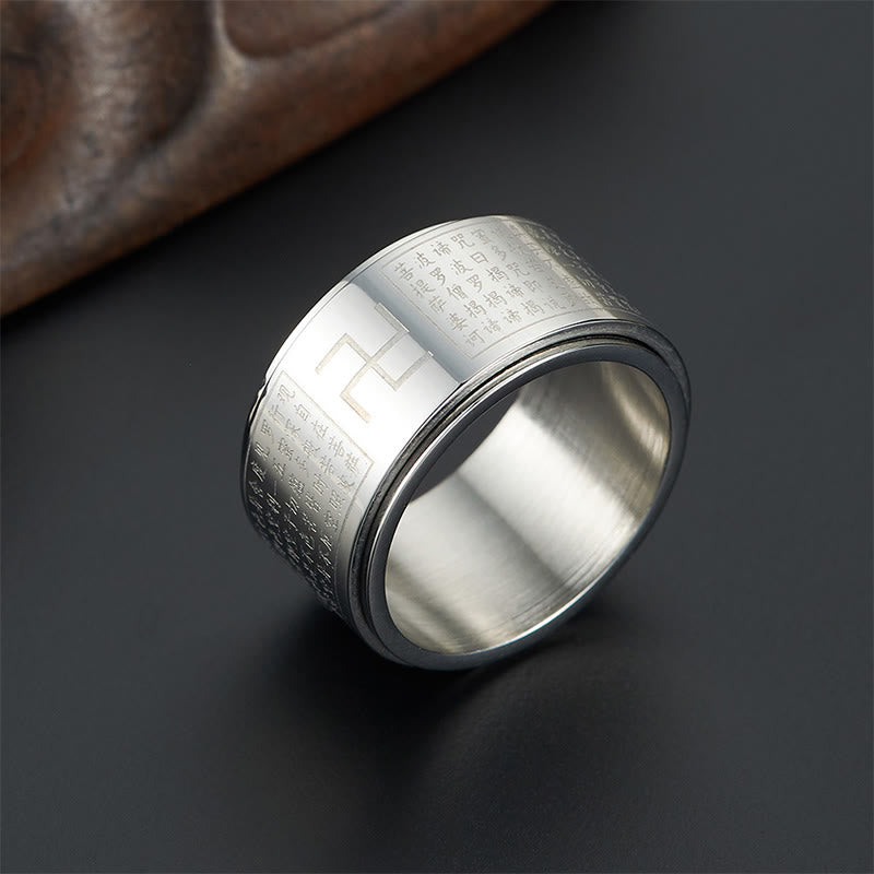 Anillo giratorio de acero y titanio con sutras y esvásticas de Buddha Stones
