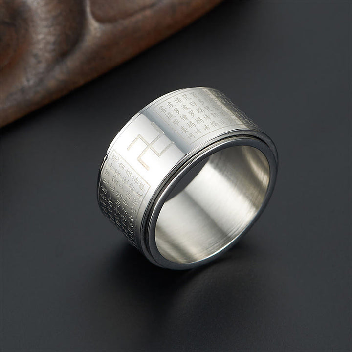 Anillo giratorio de acero y titanio con sutras y esvásticas de Buddha Stones