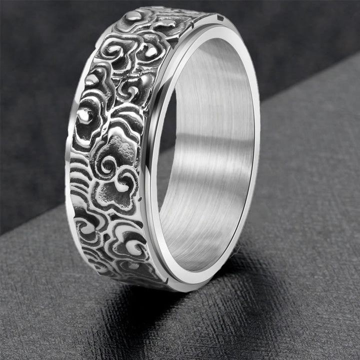 Anillo giratorio de equilibrio de acero de titanio tallado con patrón de nubes auspiciosas y Buddha Stones