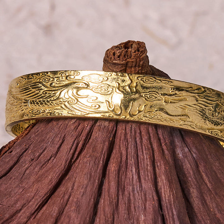 Pulsera de cobre y latón con la suerte tallada en sutra del corazón con Buddha Stones, dragón y fénix jugando con una perla