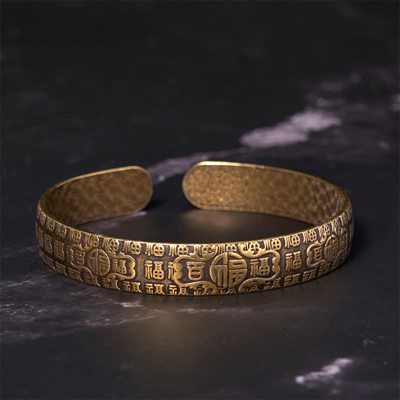 Pulsera de cobre y latón con símbolo de la suerte de Buddha Stones de las cien bendiciones