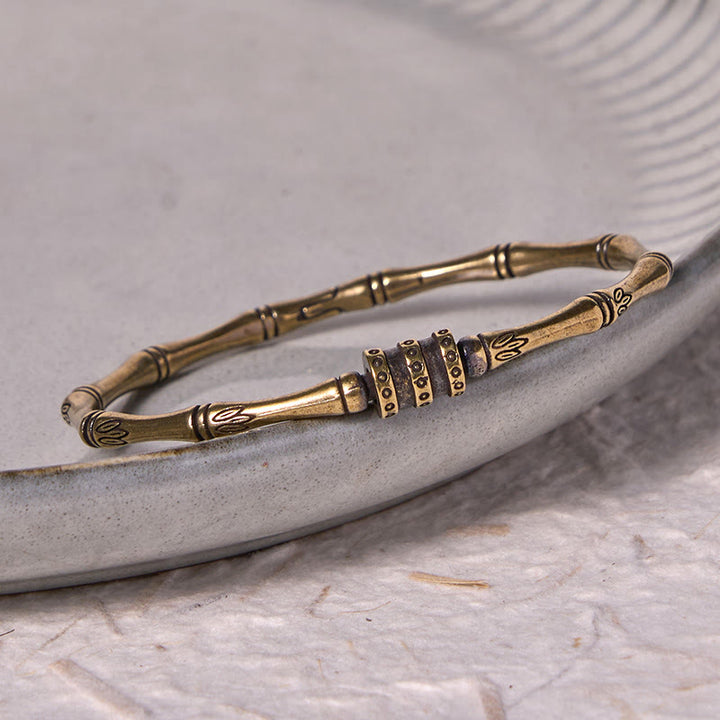 Pulsera de la paz de latón y cobre con flor de loto de bambú y Buddha Stones