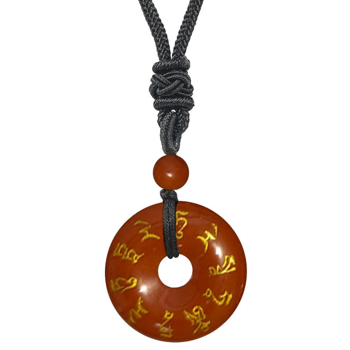 Collar con colgante de obsidiana negra con cristales naturales de varios tipos y Buddha Stones con mantra de Tara verde