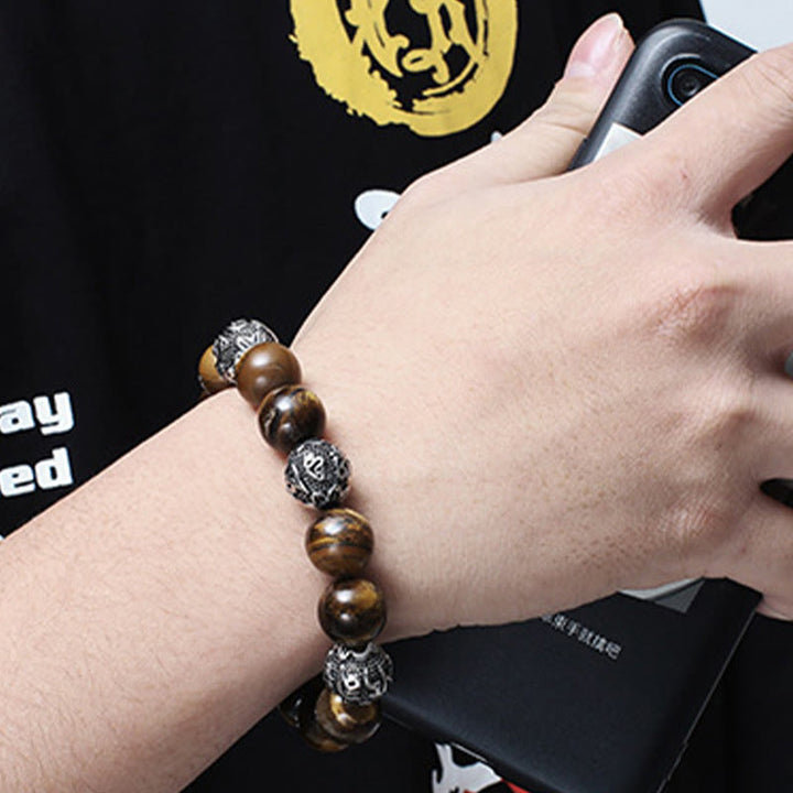Pulsera curativa Om Mani Padme Hum de seis palabras verdaderas con piedra de lava natural de Buddha Stones y ojo de tigre de acero de titanio