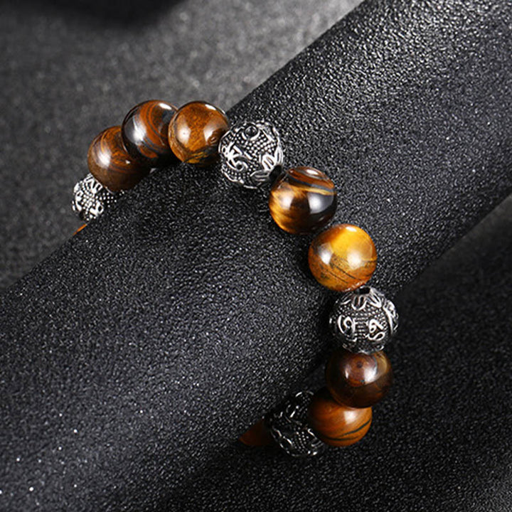 Pulsera curativa Om Mani Padme Hum de seis palabras verdaderas con piedra de lava natural de Buddha Stones y ojo de tigre de acero de titanio