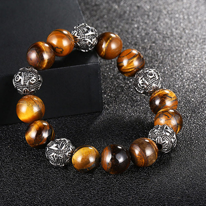 Pulsera curativa Om Mani Padme Hum de seis palabras verdaderas con piedra de lava natural de Buddha Stones y ojo de tigre de acero de titanio